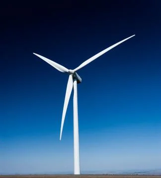 Power generating windmill with a deep blue sky Stock Photos
