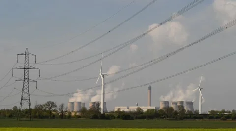 Power generating windmills by Drax coal powered power station yorkshire uk Video stock 49851139