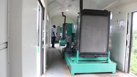 Power generator in a speeding train as engineer looks on Stock Footage 75894019