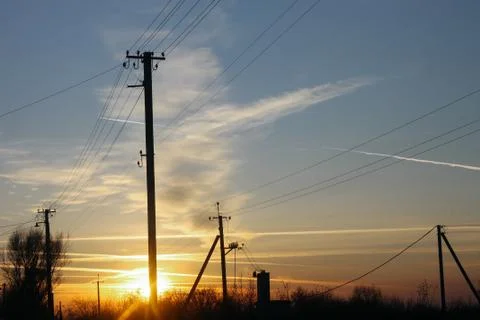 Power grids on the background of the sunset Stock Photos
