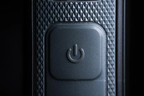 The power icon button is close on the flash for camera device. Old and dirty Fotos Stock