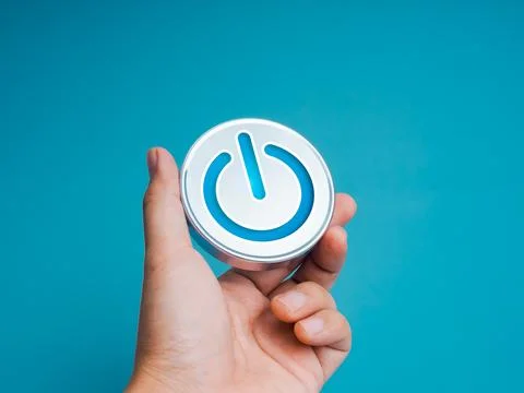 Power on, icon on chrome button or metallic badge in businessman hand, isol.. Stock Photos