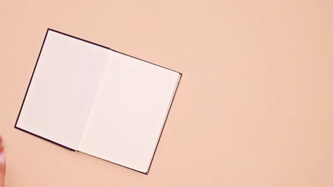 The Power of Imagination: Vintage Book Opens Against a Vivid Background Stock Footage 254863786