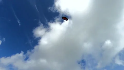 Power kite flying high in the sky with a blue summer sky in the back ground Stock Footage 144592082