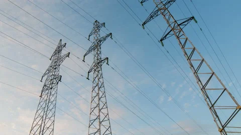 Power line against a cloudy sky . The video ends at sunset. Time lapse. Stock Footage 112327098