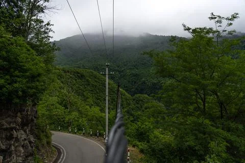 Power line cable with mountain view in clouds Georgia Foto stock