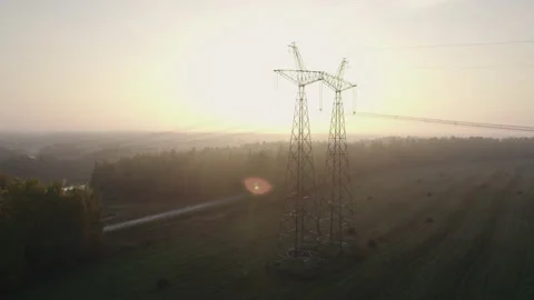 Power line in the countryside at dawn. Stock Footage 166316968