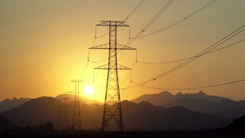 Power Line High Voltage Electricity Pylons at Sunset Stock Footage 100331298