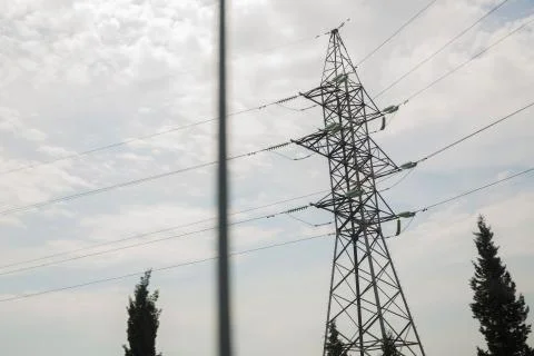 Power line high voltage post with blue sky background.Electricity pylon on na Stock Photos