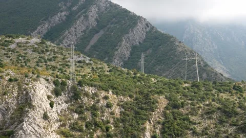 A power line in the mountains. Electrification of mountainous terrain. Stock Footage 253560959