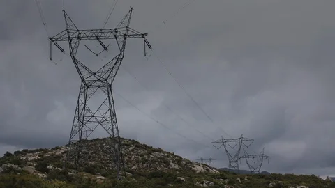 Power line in mountains with heavy clouds time lapse, 4K. Stock Footage 111090860