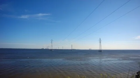 Power line passing through the river Stock Footage 90603096