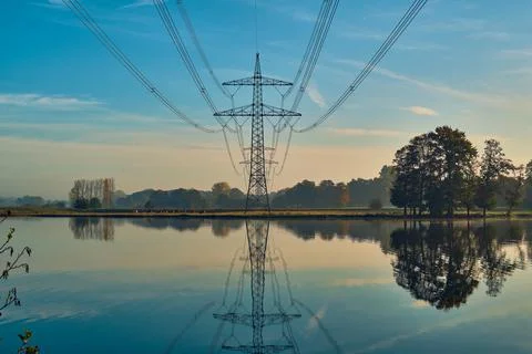 Power line reflection in lake Stock Photos
