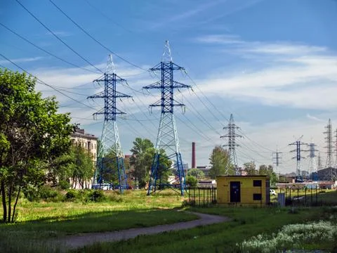 Power line support structures of various shapes and purposes in the summer in Stock Photos
