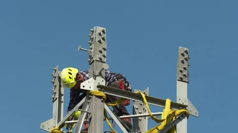 Power Line Technician Working on Top of Transmission Tower Stock-Footage 346305014