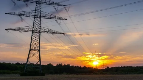 Power Line Timelapse with beautiful Sundown Pan Up Stock Footage 136983406
