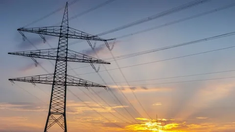 Power Line Timelapse with beautiful Sundown Pan Down Stock Footage 136983611
