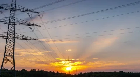 Power Line Timelapse with beautiful Sundown Pan Left Stock Footage 136983824