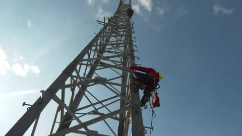 Power Line Worker Climbing Transmission Tower Stock-Footage 346302550
