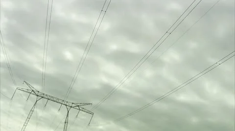 Power lines against a cloudy sky Stock Footage 11292544