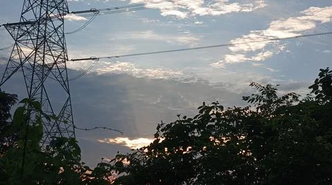 Power Lines Against a Dramatic Cloudy Sky Stock Photos