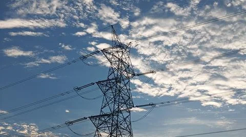 Power Lines Against a Dramatic Cloudy Sky Stock Photos