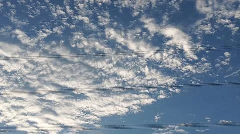 Power Lines Against a Dramatic Cloudy Sky Stock Photos