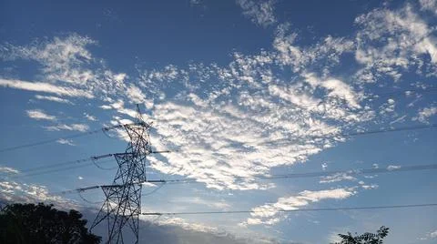Power Lines Against a Dramatic Cloudy Sky Stock Photos