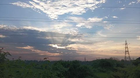 Power Lines Against a Dramatic Cloudy Sky Stock Photos