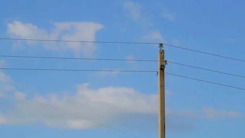 Power lines against the sky with clouds. Time laps Stockbeeldmateriaal 108400174