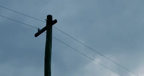 Power lines against timelapse dark clouds Stock Footage 164908009