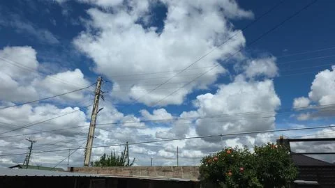 Power Lines and Clouds Blue Sky Stock Photos
