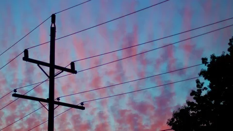 Power lines and clouds as the sun sets. Stock Footage 93782398
