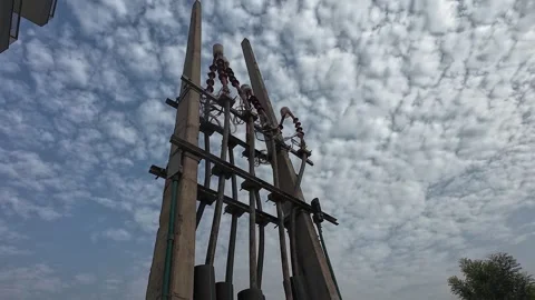 Power Lines and Electrical Tower Against a Cloudy Sky Stock Footage 280910559