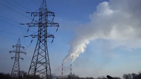 Power lines and pipe smoke power plant against blue sky. Stock Footage 73906601