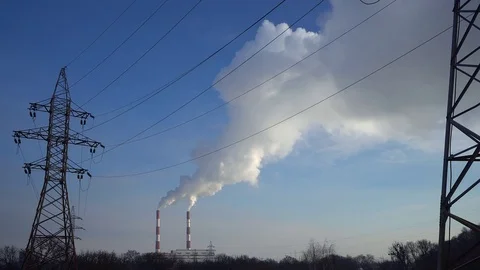 Power lines and pipe smoke power plant against blue sky. Видео 73907041