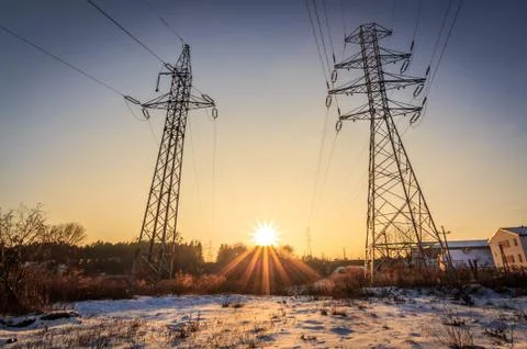 Power lines and rays of the sun Stock Photos