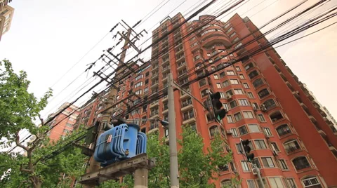 Power Lines and Transformer in front of Shanghai Condominiums Stock Footage 39593906