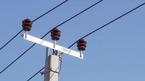 Power lines on background of blue sky close-up. Video stock 296087062
