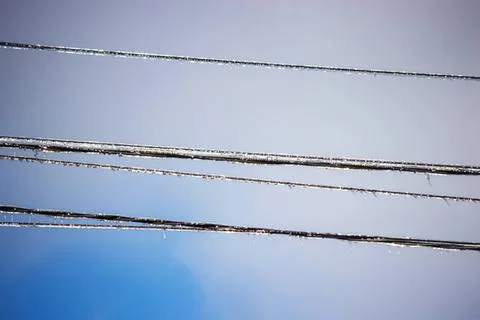 Power lines on a clear sky background during daytime Stock Photos