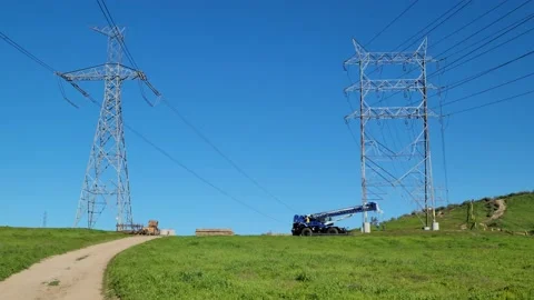 Power lines with construction machinery Stock Footage 231343887