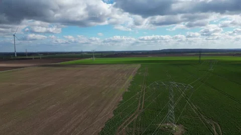 Power Lines Crossing Agricultural Fields in Germany – 4K Aerial Drone Stock Footage 341850074