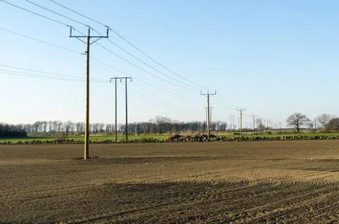 Power lines in farmers fields Foto stock