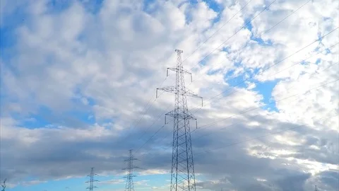 Power lines on a field on summer day timelapse Stock Footage 81601870