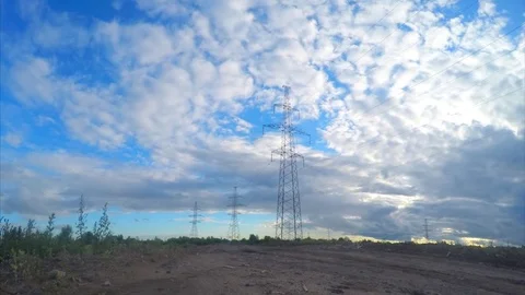Power lines on a field on summer timelapse 動画素材 81605299
