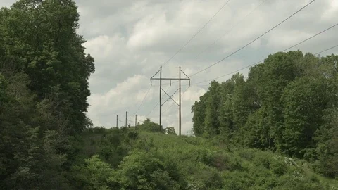 Power Lines on Hilltop in Rural Setting Stock Footage 77316476