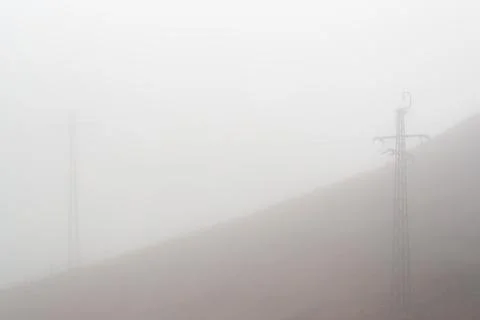 Power Lines into the Mist Stock Photos