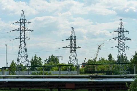 Power lines running through the forest. The support of an overhead power line Stock Photos