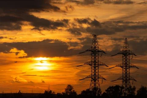 Power lines in the setting sun Stock Photos