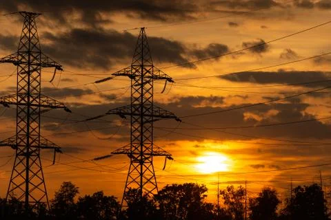 Power lines in the setting sun Stock Photos